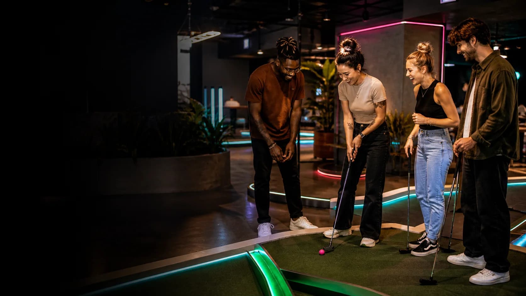 Friends enjoying a last-minute mini-golf night